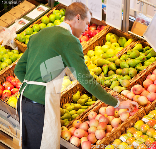 Image of Man Working in Grocery Store