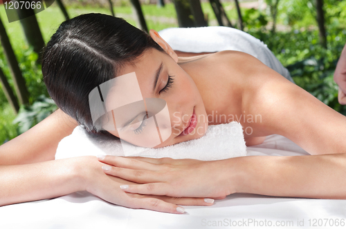 Image of Beautiful young woman relaxing