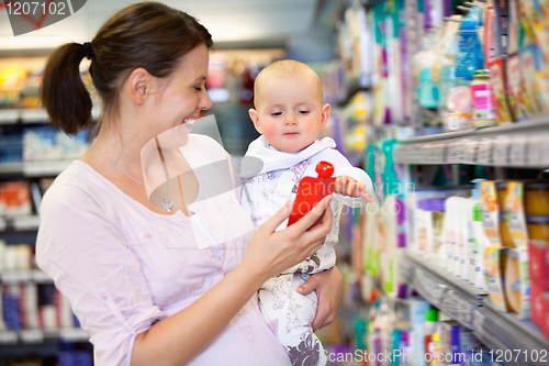 Image of Mother Shopping with Baby in Supermarket