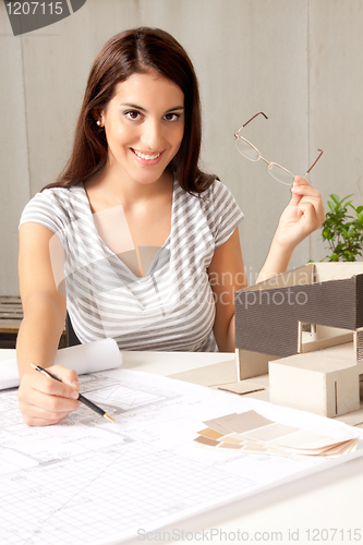 Image of Architect with Blueprints and House Model