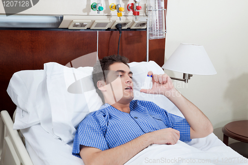 Image of Patient using asthma inhaler