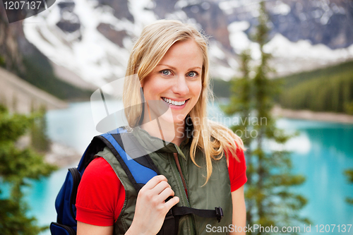 Image of Beautiful female hiker smiling