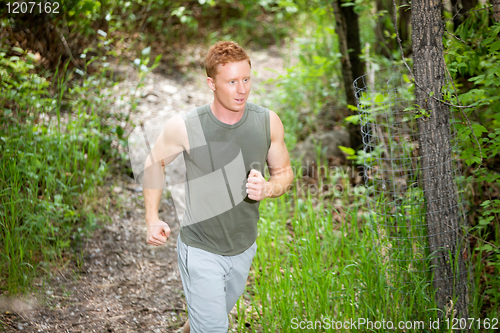 Image of Young man jogging