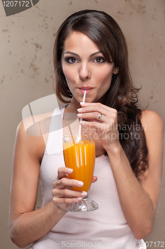Image of Woman drinking orange juice