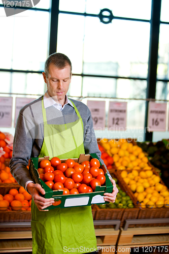 Image of Grocer with Tomatoes