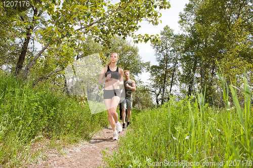 Image of People in sportswear jogging