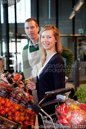 Image of Supermarket Woman and Clerk