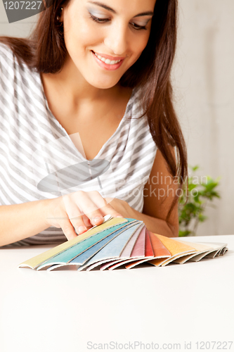 Image of Woman looking at Color Swatches