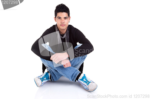 Image of Handsome Young Man Sitting on the Floor