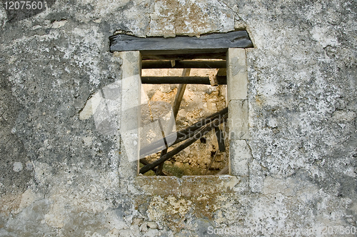 Image of weathered wall window