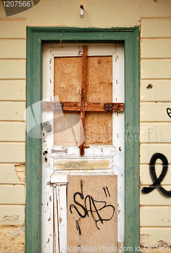 Image of boarded up door