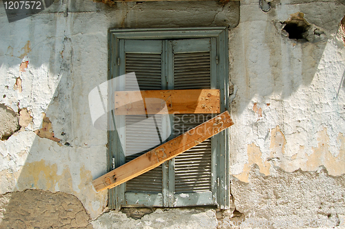 Image of boarded up window