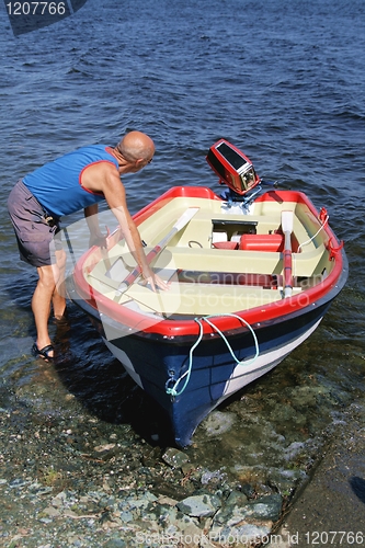 Image of Man with a boat