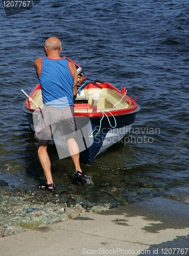 Image of Man with a boat