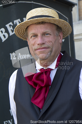 Image of Portrait of a man with a straw hat.