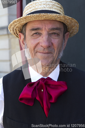 Image of A man with a straw hat.