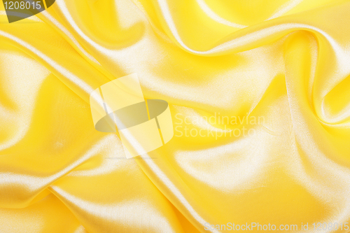Image of Smooth elegant golden silk as background 