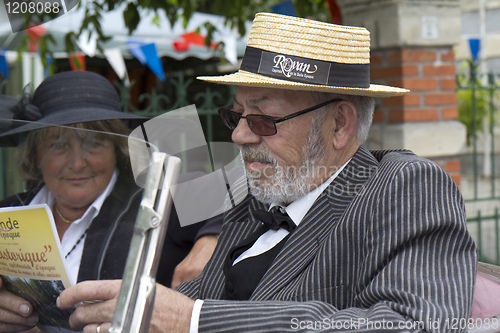 Image of Driver with a straw hat.