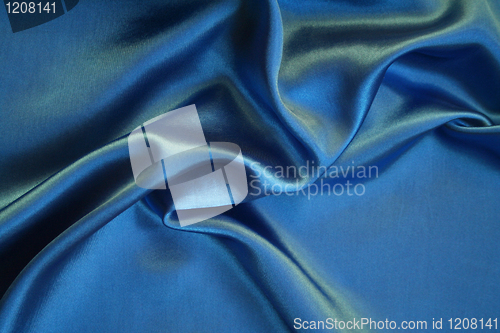 Image of Smooth elegant blue silk as background 