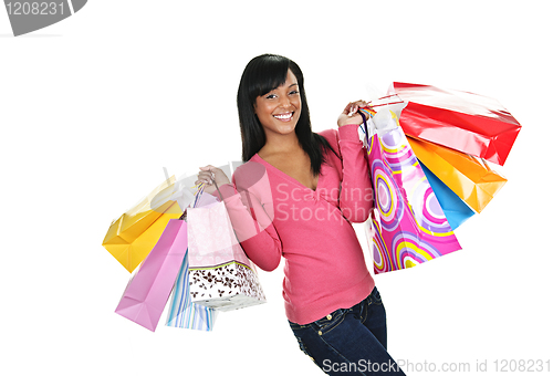 Image of Happy young black woman with shopping bags