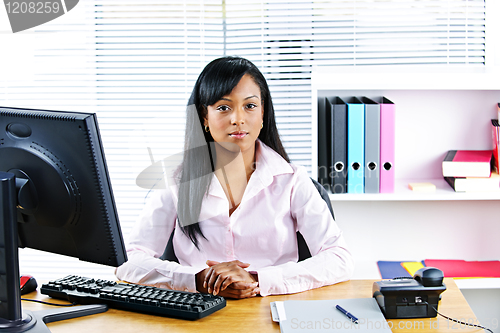 Image of Black businesswoman at desk