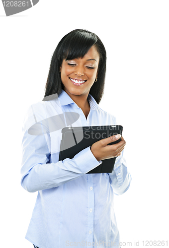 Image of Happy woman with tablet computer