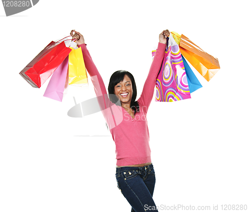 Image of Excited young black woman with shopping bags