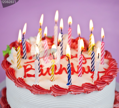 Image of Birthday cake with lit candles