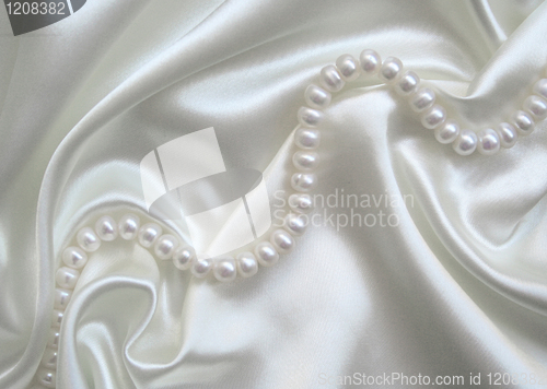 Image of Smooth elegant white silk with pearls as wedding background 