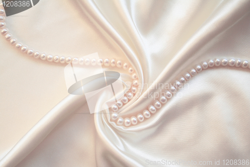 Image of Smooth elegant white silk with pearls as wedding background 