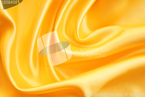 Image of Smooth elegant golden silk as background 