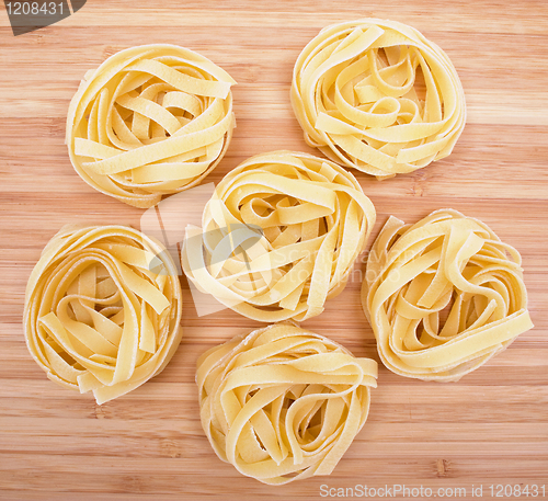 Image of Tagliatelle on the wooden background