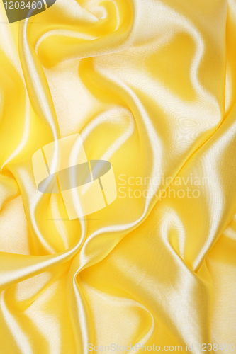 Image of Smooth elegant golden silk as background 
