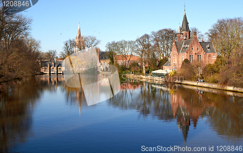 Image of lake reflects of littel palace. Bruges