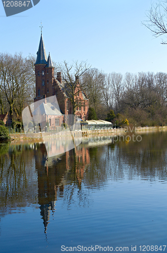 Image of lake reflects of littel palace. Bruges