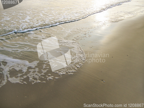 Image of wave on sand