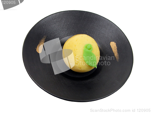 Image of Lemon shape cake on a wooden plate-clipping path