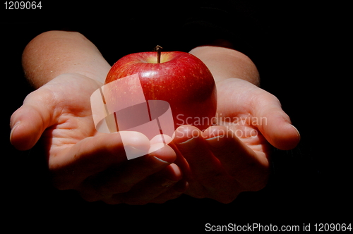 Image of hand with apple