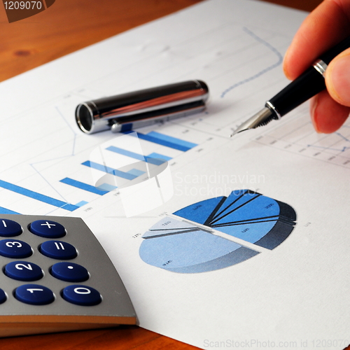 Image of business chart and hand