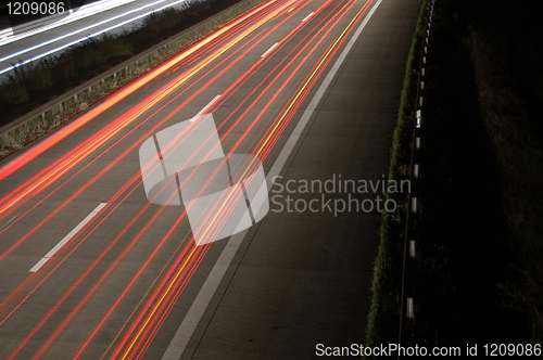 Image of highway at night with traffic