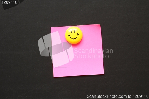 Image of smiley and paper with copyspace