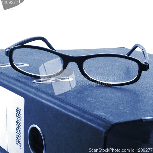 Image of eye glasses and folder