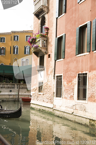 Image of canal scene with gondola boat Venice Italy