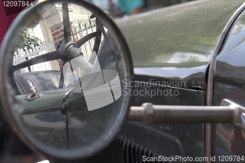 Image of  Old car side mirror.