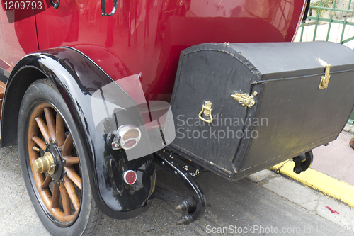 Image of  Boot of a  red vintge car.