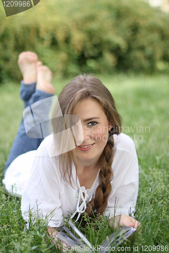 Image of Smiling girl on the grass