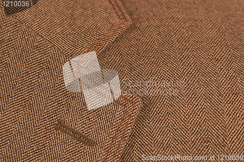 Image of brown elegant buttonhole suit