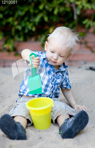 Image of toddler playing in sandbox