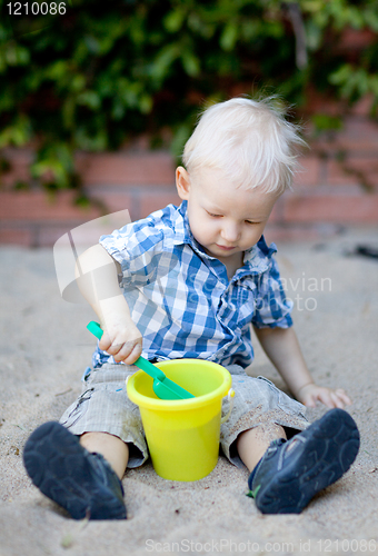 Image of toddler playing in sandbox