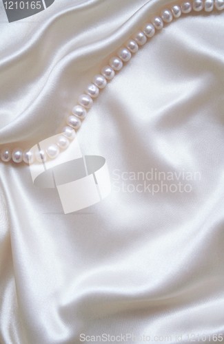 Image of Smooth elegant white silk with pearls as wedding background